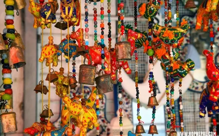 Collection of authentic traditional Nepali handicrafts showcasing intricate wooden carvings, Thangka paintings, and Pashmina shawls